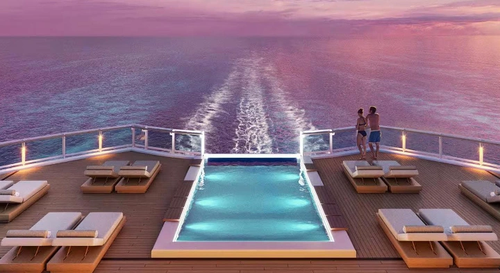 A peaceful pool overlooking the sea at sunset